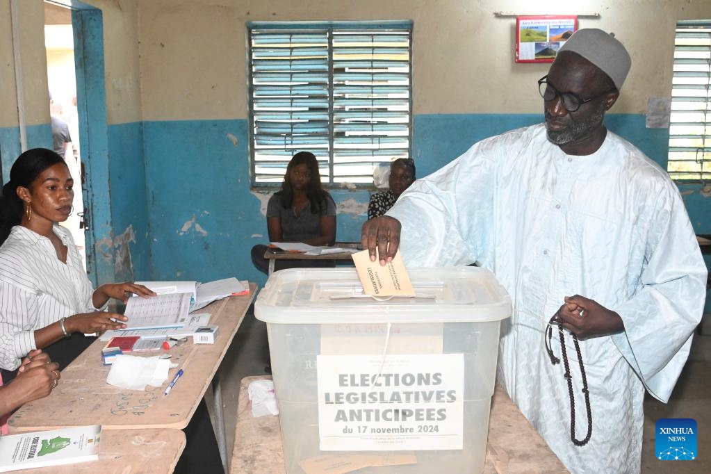 A man votes at a polling station in Dakar, Senegal, on Nov. 17, 2024. Polling stations officially opened at 8 a.m., local time, Sunday throughout Senegal and abroad for the legislative elections.(Photo by Papa Demba Gueye/Xinhua)