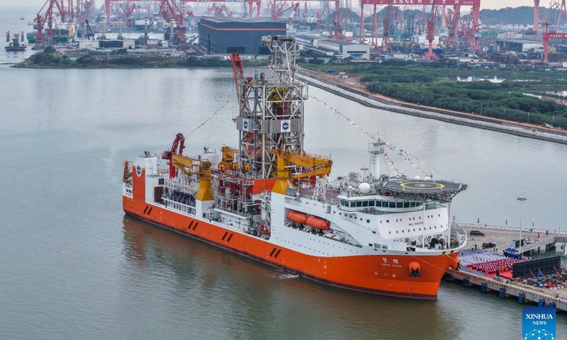 An aerial drone photo shows the Meng Xiang, China's first domestically designed and built deep-ocean drilling vessel, in Guangzhou, south China's Guangdong Province, Nov. 17, 2024. The Meng Xiang, China's first domestically designed and built deep-ocean drilling vessel with a maximum drilling depth of 11 kilometers was officially commissioned in the southern Chinese metropolis of Guangzhou on Sunday, marking a significant stride to reach where humanity has never ventured before. (Xinhua/Liu Dawei)