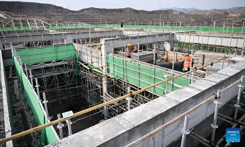 People work at the construction site of Fuping Railway Station of the Xiong'an-Xinzhou High-speed Railway in north China's Hebei Province, Nov. 18, 2024. The construction of the main structure of Fuping Railway Station was capped on Monday, which is now followed by steel structure installation. (Photo: Xinhua)