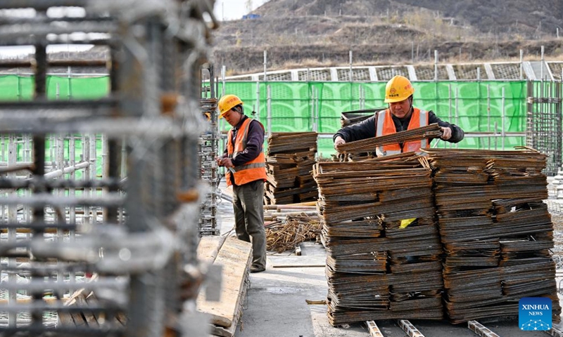 People work at the construction site of Fuping Railway Station of the Xiong'an-Xinzhou High-speed Railway in north China's Hebei Province, Nov. 18, 2024. The construction of the main structure of Fuping Railway Station was capped on Monday, which is now followed by steel structure installation. (Photo: Xinhua)