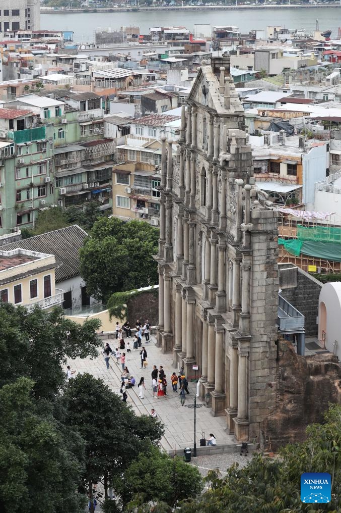 Tourists visit the Ruins of St. Paul's in south China's Macao, Nov. 18, 2024. The Historic Center of Macao, with its historic street and various historical buildings, has been accepted on the World Heritage List by the United Nations Educational, Scientific and Cultural Organization (UNESCO) in 2005. (Photo: Xinhua)