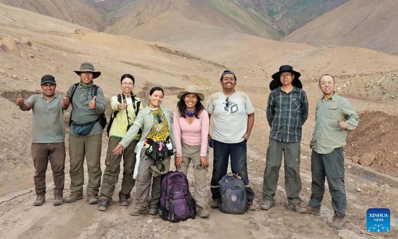 This file photo taken on Nov. 9, 2018 shows Ge Xuejun (1st R), a researcher of the South China Botanical Garden of the Chinese Academy of Sciences, posing for a group photo with other researchers while conducting scientific research in Peru. (Photo: Xinhua)