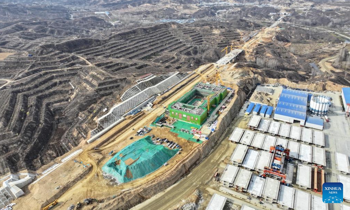 An aerial drone photo taken on Nov. 18, 2024 shows the construction site of Fuping Railway Station of the Xiong'an-Xinzhou High-speed Railway in north China's Hebei Province. The construction of the main structure of Fuping Railway Station was capped on Monday, which is now followed by steel structure installation.(Photo: Xinhua)