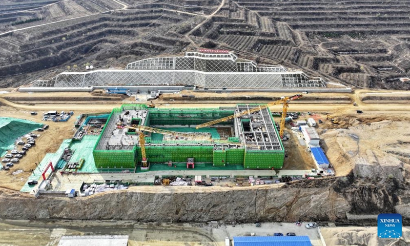 People work at the construction site of Fuping Railway Station of the Xiong'an-Xinzhou High-speed Railway in north China's Hebei Province, Nov. 18, 2024. The construction of the main structure of Fuping Railway Station was capped on Monday, which is now followed by steel structure installation. (Photo: Xinhua)