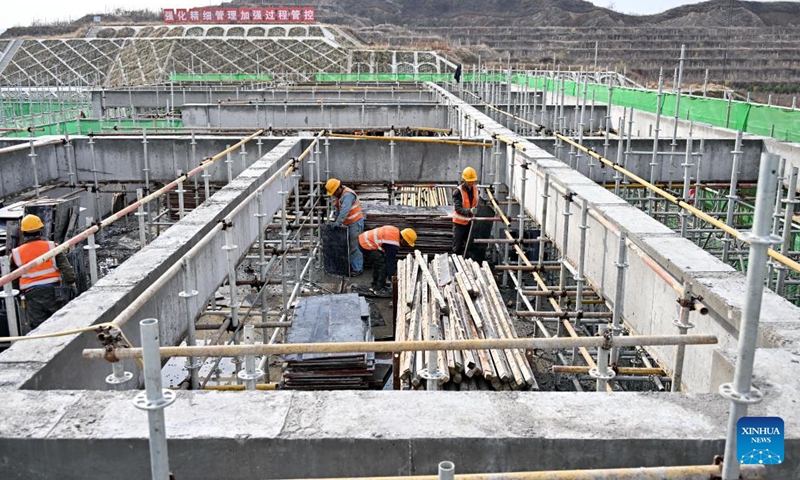 People work at the construction site of Fuping Railway Station of the Xiong'an-Xinzhou High-speed Railway in north China's Hebei Province, Nov. 18, 2024. The construction of the main structure of Fuping Railway Station was capped on Monday, which is now followed by steel structure installation. (Photo: Xinhua)