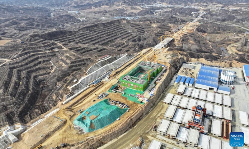 An aerial drone photo taken on Nov. 18, 2024 shows the construction site of Fuping Railway Station of the Xiong'an-Xinzhou High-speed Railway in north China's Hebei Province. The construction of the main structure of Fuping Railway Station was capped on Monday, which is now followed by steel structure installation.(Photo: Xinhua)