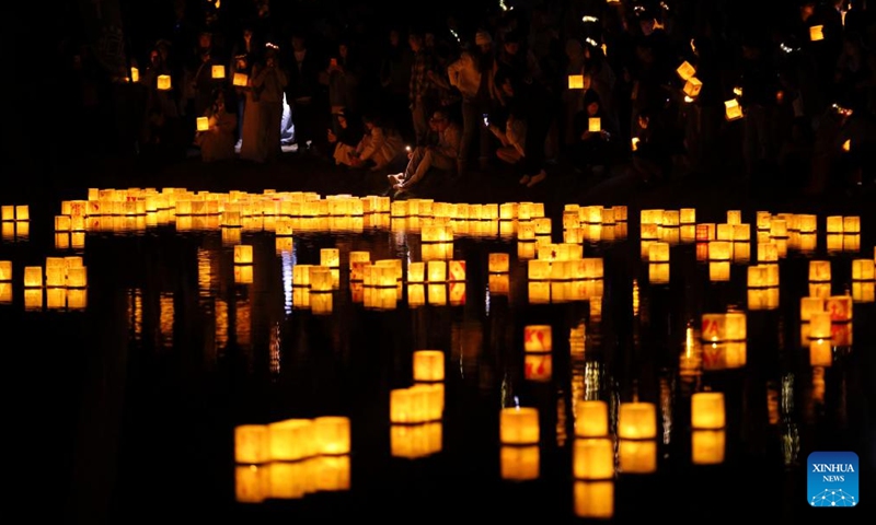 People set afloat water lanterns during a water lantern festival in South El Monte, Los Angeles, California, the United States, on Nov. 17, 2024. (Photo: Xinhua)