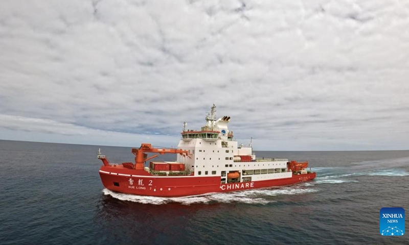 An aerial drone photo shows China's research icebreaker Xuelong 2 sailing in the sea. Currently on China's 41st Antarctic expedition, research icebreakers Xuelong and Xuelong 2, or Snow Dragon and Snow Dragon 2, will begin to plough through the belt of prevailing westerlies, nicknamed the rolling forties, on Tuesday. (Photo by Chen Dongbin/Xinhua)