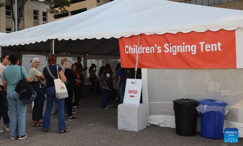 People line up to get the authors' signature during the Texas Book Festival in Austin, Texas, the United States, Nov. 16, 2024. (Photo: Xinhua)