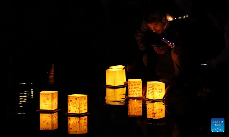 People set afloat water lanterns during a water lantern festival in South El Monte, Los Angeles, California, the United States, on Nov. 17, 2024. (Photo: Xinhua)