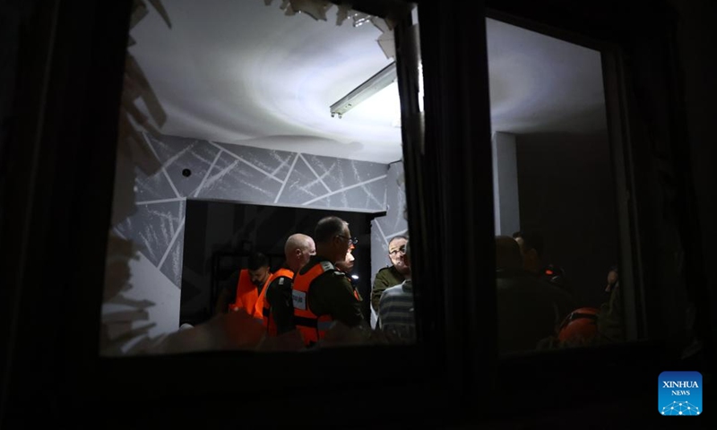 Israeli emergency team members work at the site of a rocket attack from Lebanon, in Shfar'am, northern Israel, on Nov. 18, 2024. A woman was killed and 10 others wounded in a rocket attack in northern Israel on Monday, Israel's Magen David Adom rescue service said. (Photo: Xinhua)