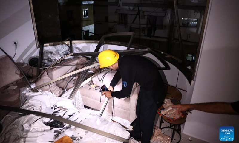 An Israeli emergency team member works at the site of a rocket attack from Lebanon, in Shfar'am, northern Israel, on Nov. 18, 2024. A woman was killed and 10 others wounded in a rocket attack in northern Israel on Monday, Israel's Magen David Adom rescue service said. (Photo: Xinhua)