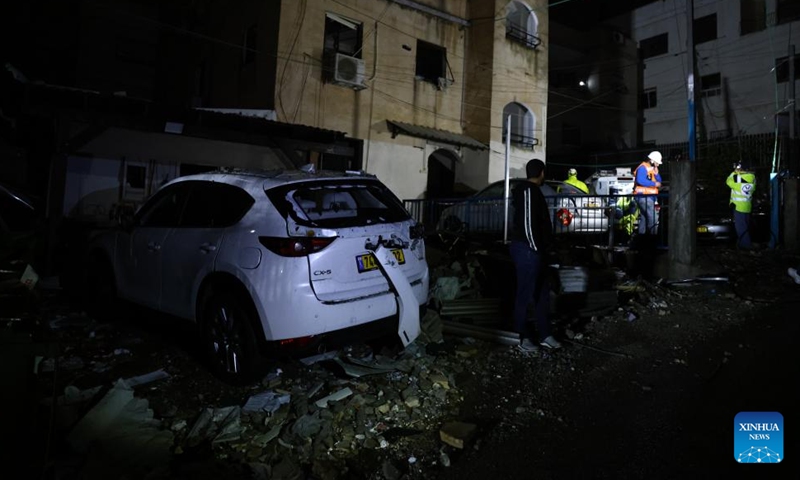 People work at the site of a rocket attack from Lebanon, in Shfar'am, northern Israel, on Nov. 18, 2024. A woman was killed and 10 others wounded in a rocket attack in northern Israel on Monday, Israel's Magen David Adom rescue service said.  (Photo: Xinhua)