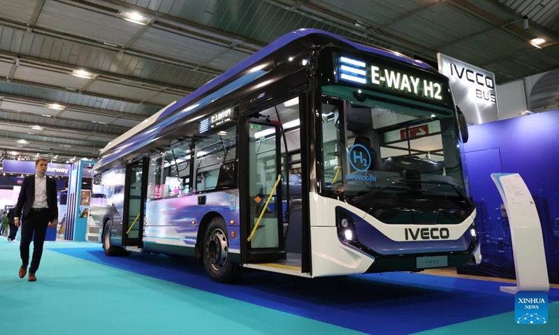 A visitor walks past an Iveco bus during the European Hydrogen Week in Brussels, Belgium, on Nov. 18, 2024. The European Hydrogen Week, the European Union's policy conference and business forum for the hydrogen sector, kicked off in Brussels on Monday.  (Photo: Xinhua)