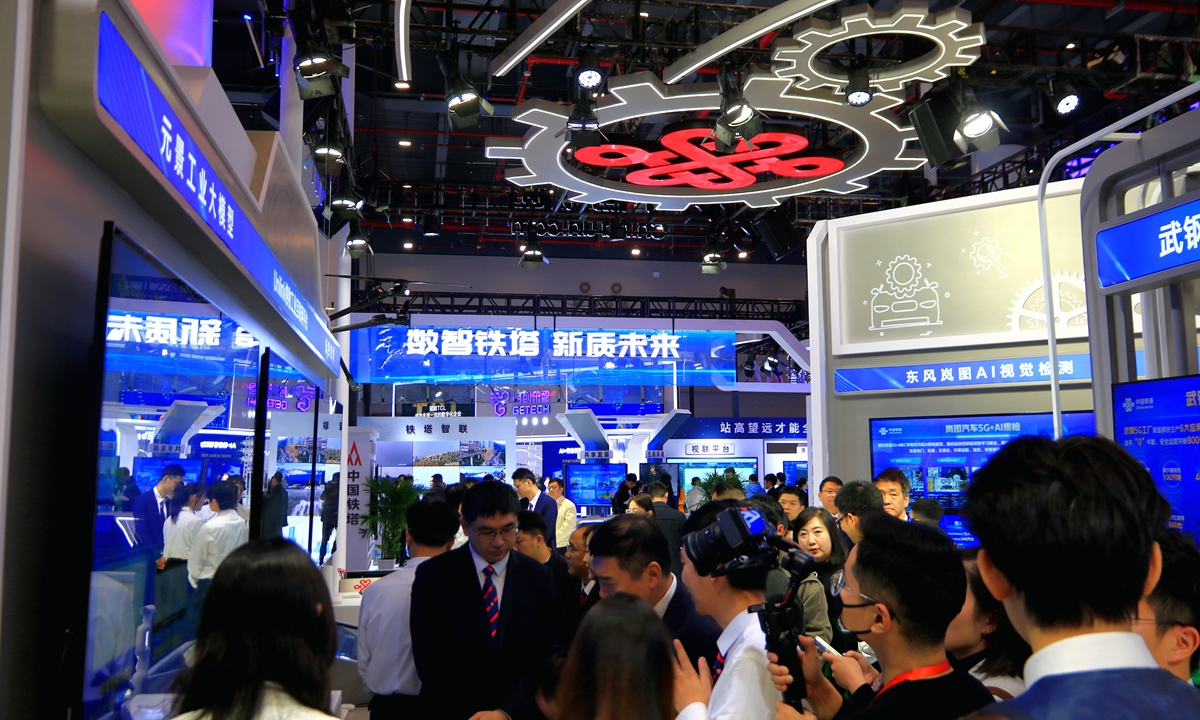 Attendees take a tour in the exhibition hall of the 2024 China 5G+ Industrial Internet Conference, which kicked off on Tuesday in Wuhan, Central China's Hubei Province. China initiated a pilot program to advance the integrated application of the 5G+ industrial internet in 10 cities, aiming to accelerate the technology's high-quality development and large-scale application. Photo: VCG 