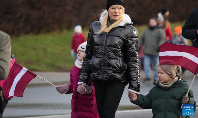 People walk to watch a military parade marking the Independence Day in Riga, Latvia, Nov. 18, 2024. Various events were held across Latvia on Monday to mark the Independence Day. (Photo: Xinhua)