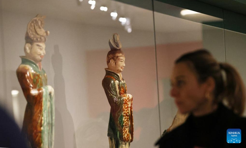 A visitor is pictured at an exhibition titled Tang China -- A Cosmopolitan Dynasty (7th-10th Century) at the Guimet National Museum of Asian Arts in Paris, France, Nov. 18, 2024. The exhibition was inaugurated Monday at France's Guimet National Museum of Asian Arts. The exhibition, directed by China's National Cultural Heritage Administration and the French Ministry of Culture, showcases over 200 pieces or sets of exquisite artifacts from 32 cultural and museum institutions in 10 provincial-level regions and cities in China. (Photo: Xinhua)