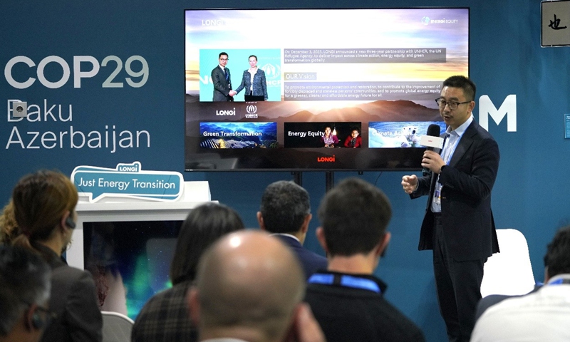 Photo: Dennis She, Vice President of LONGi, addresses a keynote speech at Blue Zone COP29, Baku Olympic Stadium