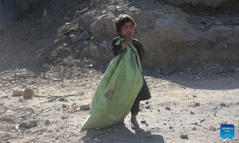 A child stands outside her mud house at a displaced camp in Kabul, Afghanistan, Nov. 19, 2024. (Photo: Xinhua)