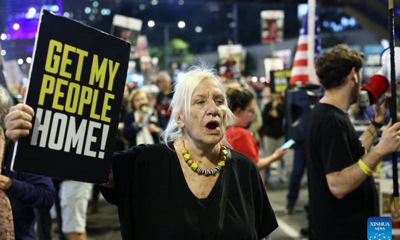 People attend a protest calling for an immediate ceasefire and the release of Israeli hostages held in Gaza, in Tel Aviv, Israel, on Nov. 21, 2024. (Photo by Jamal Awad/Xinhua)