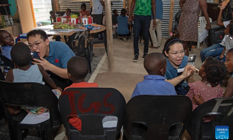 Members of the Chinese medical team conduct oral examinations for children at the Frans Nambinga Arts and Training Center in Windhoek, Namibia, Nov. 20, 2024. (Xinhua/Chen Cheng)