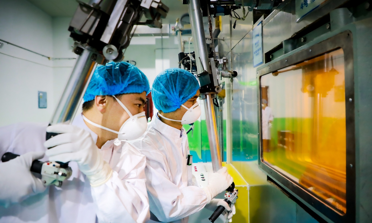 Staff members of the China Isotope & Radiation Corporation conduct operations for the production of radioactive sources. Photo: Courtesy of CNNC