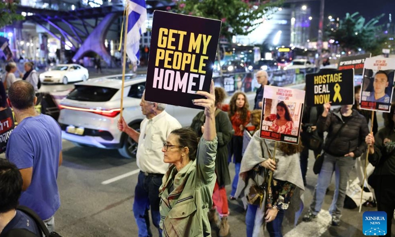 People attend a protest calling for an immediate ceasefire and the release of Israeli hostages held in Gaza, in Tel Aviv, Israel, on Nov. 21, 2024. (Photo by Jamal Awad/Xinhua)