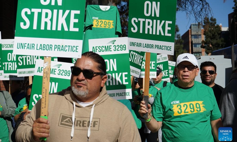 Healthcare workers protest in front of the Ronald Reagan UCLA Medical Center in Los Angeles, California, the United States, on Nov. 20, 2024. (Photo by Zeng Hui/Xinhua)