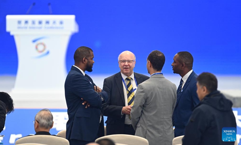 Guests communicate ahead of the opening ceremony of the 2024 World Internet Conference (WIC) Wuzhen Summit in Wuzhen, east China's Zhejiang Province, Nov. 20, 2024. The 2024 WIC Wuzhen Summit kicked off on Wednesday morning in the ancient water town of Wuzhen in east China's Zhejiang Province. (Xinhua/Huang Zongzhi)