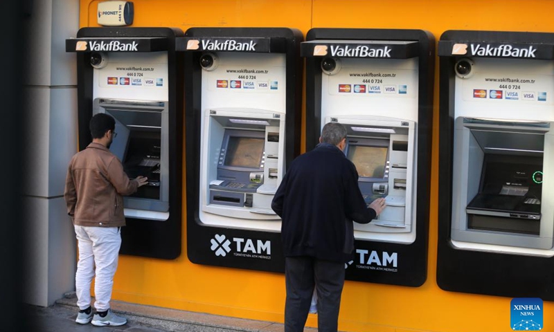 People withdraw money from ATMs in Ankara, Türkiye, on Nov. 21, 2024. Türkiye's central bank held its key interest rate steady at 50 percent on Thursday for the eighth straight month, in line with market expectations. (Mustafa Kaya/Handout via Xinhua)