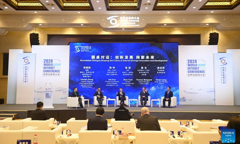 Guests attend a roundtable during the 2024 World Internet Conference (WIC) Wuzhen Summit in Wuzhen, east China's Zhejiang Province, Nov. 21, 2024. The 2024 WIC Wuzhen Summit kicked off on Wednesday morning in the ancient water town of Wuzhen in east China's Zhejiang Province. (Xinhua/Huang Zongzhi)