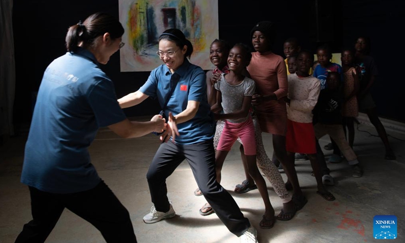 Members of the Chinese medical team play games with children at the Frans Nambinga Arts and Training Center in Windhoek, Namibia, Nov. 20, 2024. (Xinhua/Chen Cheng)