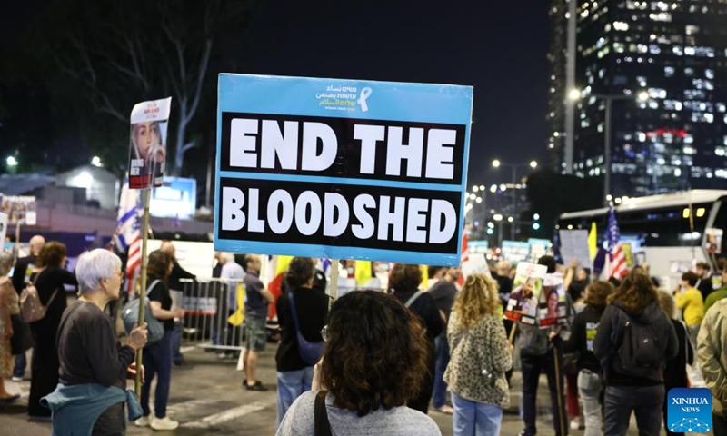 People attend a protest calling for an immediate ceasefire and the release of Israeli hostages held in Gaza, in Tel Aviv, Israel, on Nov. 21, 2024. (Photo by Jamal Awad/Xinhua)