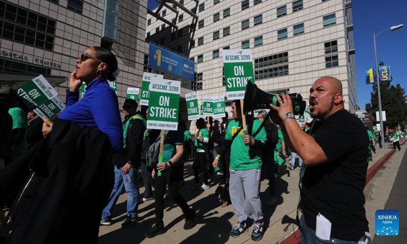 Healthcare workers protest in front of the Ronald Reagan UCLA Medical Center in Los Angeles, California, the United States, on Nov. 20, 2024. (Photo by Qiu Chen/Xinhua)