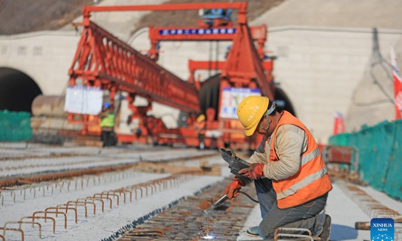 A man performs welding operation on a bridge of the Lingyuan-Suizhong expressway in northeast China's Liaoning Province, Nov. 19, 2024. The expressway linking the counties of Lingyuan and Suizhong both in Liaoning, when completed, will be a new passage to the sea for the western part of the province. (Xinhua/Yang Qing)