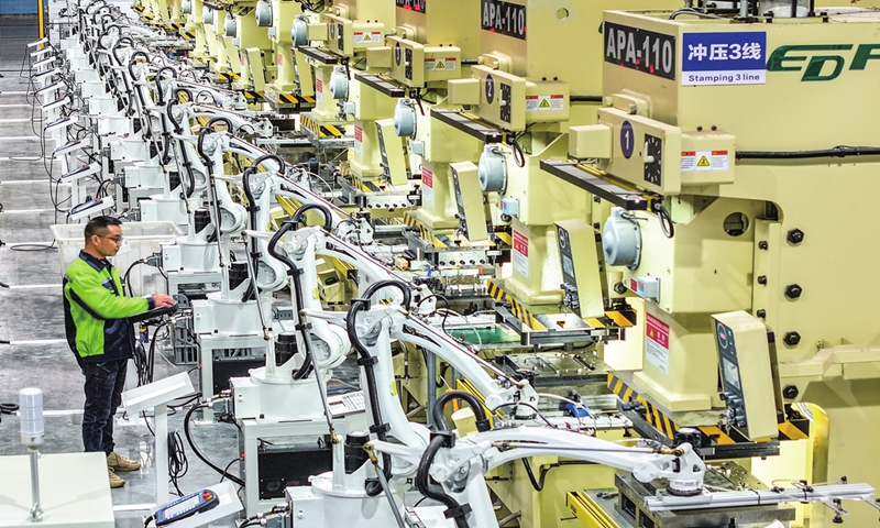 A staff member checks on an intelligent facility while ramping up production at a company in Huaying, Southwest China's Sichuan Province on November 20, 2024. The city has been supporting the smart and digital transformation of local enterprises. Photo: VCG