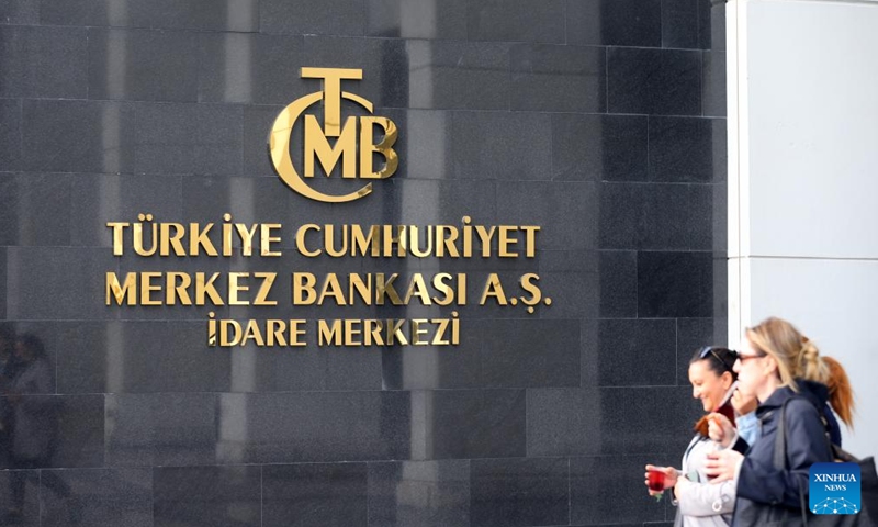 People walk past Türkiye's central bank in Ankara, Türkiye, on Nov. 21, 2024. Türkiye's central bank held its key interest rate steady at 50 percent on Thursday for the eighth straight month, in line with market expectations. (Mustafa Kaya/Handout via Xinhua)