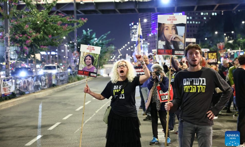 People attend a protest calling for an immediate ceasefire and the release of Israeli hostages held in Gaza, in Tel Aviv, Israel, on Nov. 21, 2024. (Photo by Jamal Awad/Xinhua)