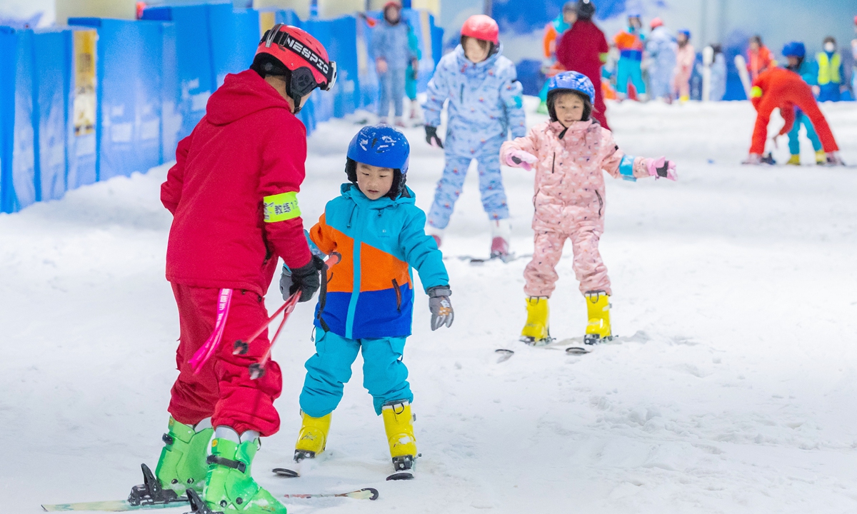 Visitors experience skiing at an indoor ski resort in East China's Zhejiang Province in May. Photo: VCG