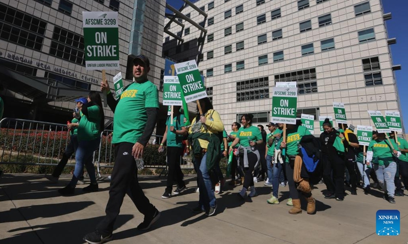 Healthcare workers protest in front of the Ronald Reagan UCLA Medical Center in Los Angeles, California, the United States, on Nov. 20, 2024. (Photo by Qiu Chen/Xinhua)