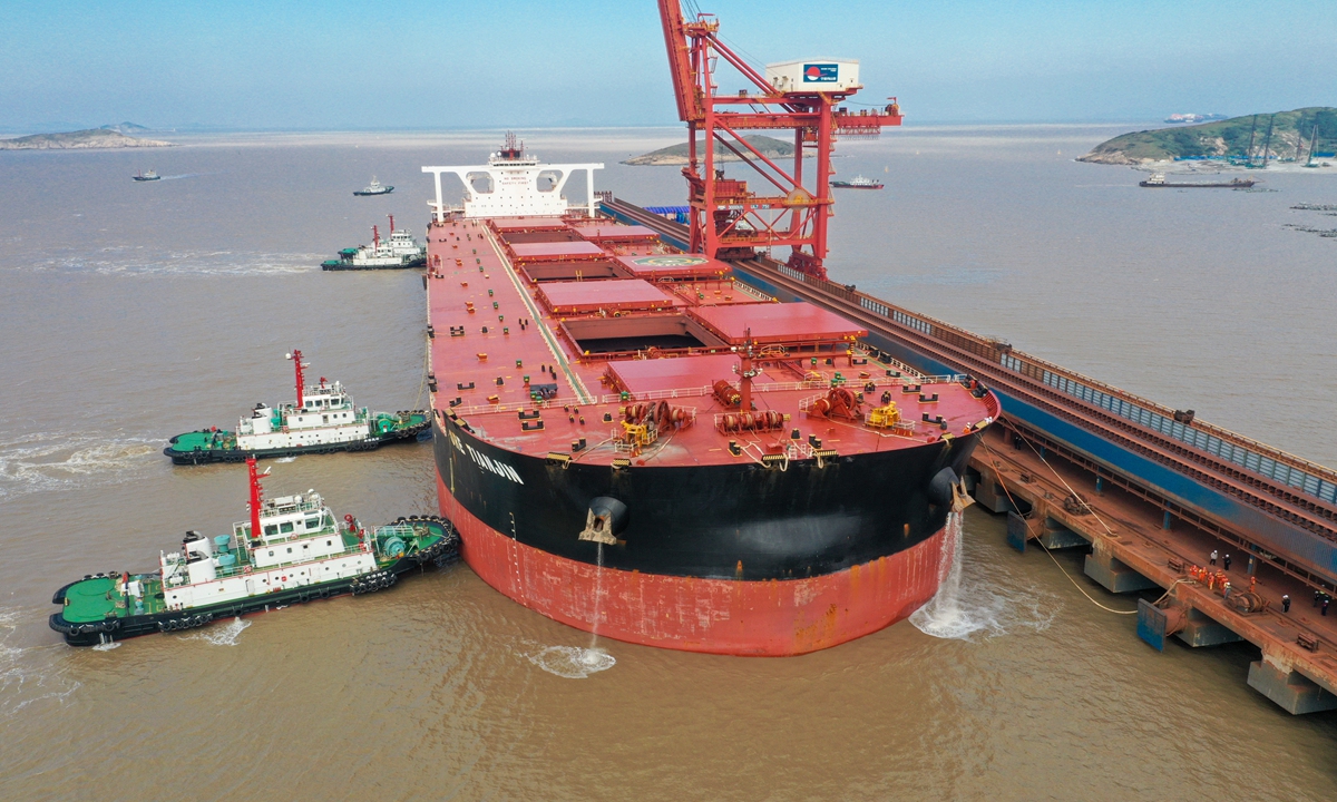 Tugs maneuver the 400,000-ton ocean-going vessel Ore Tianjin to a berth at Zhoushan?Port, Ningbo in East China's Zhejiang Province? on November 21, 2024. It will be joined by another 400,000-ton ore carrier, marking a global maritime history first: the simultaneous docking and unloading of two of the world's largest ore carriers at the same single-body terminal. Photo: VCG