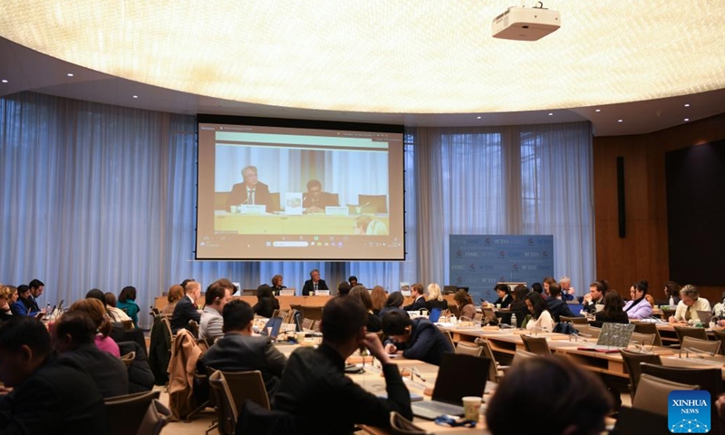 People attend a conference at the World Trade Organization (WTO) headquarters in Geneva, Switzerland, Nov. 21, 2024. The WTO released a report on Thursday titled Trading with Intelligence: How AI Shapes and is Shaped by International Trade, exploring the potential impact of artificial intelligence (AI) on global trade. (Xinhua/Lian Yi)