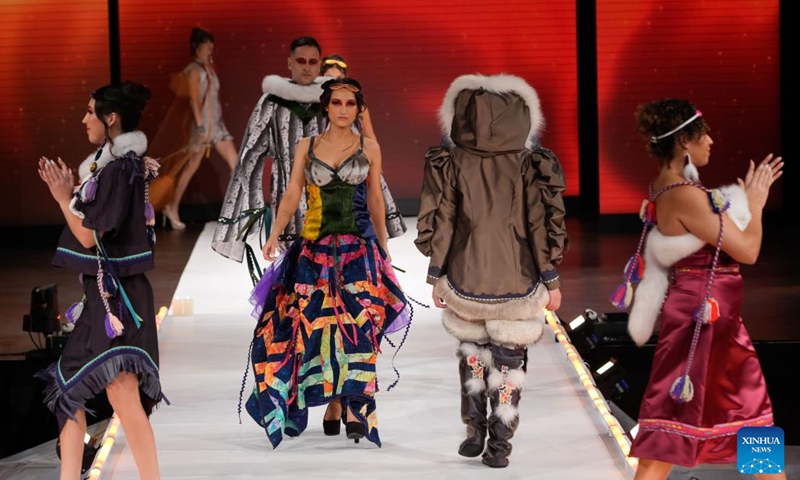 Models present creations during the runway show at Vancouver Indigenous Fashion Week 2024 in Vancouver, British Columbia, Canada, Nov. 20, 2024. (Photo by Liang Sen/Xinhua)