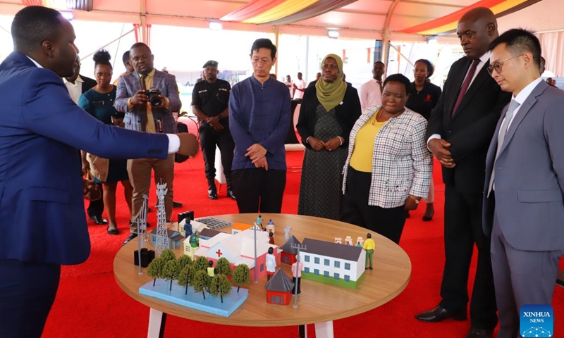 Ugandan Prime Minister Robinah Nabbanja (3rd R, Front) and other officials listen to an introduction of a Huawei smart village during a job fair in Kampala, Uganda, on Nov. 21, 2024. The Ugandan government and Chinese technology firm Huawei on Thursday launched a two-day job fair aimed at promoting youth employment in the information, communication and technology (ICT) sector. (Photo by Ronald Ssekandi/Xinhua) 