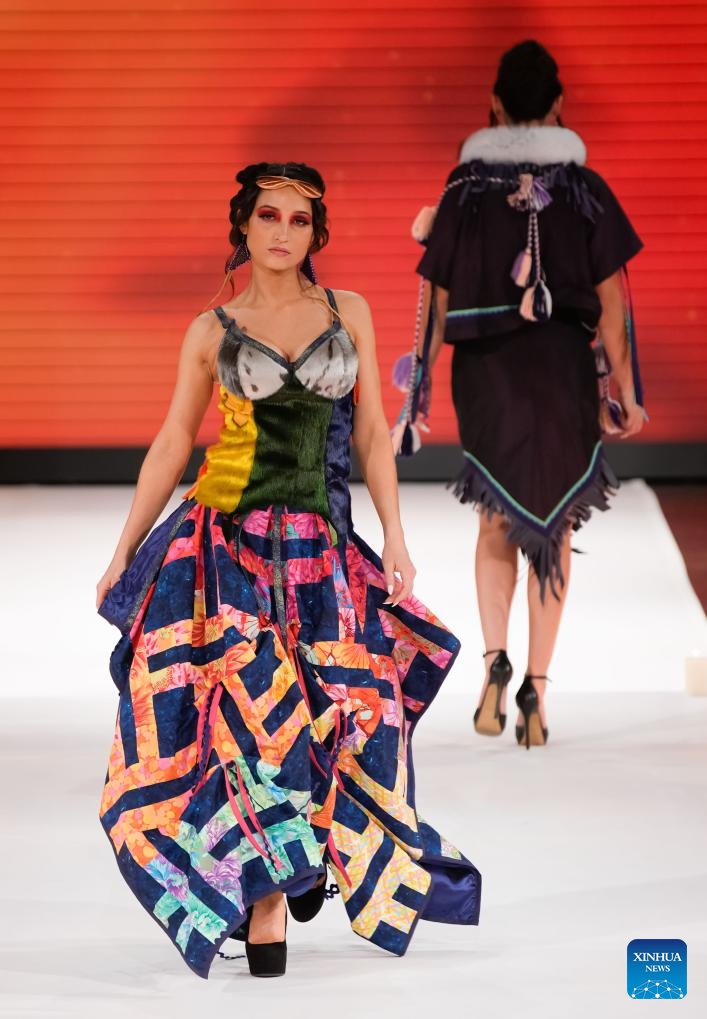 A model presents a creation during the runway show at Vancouver Indigenous Fashion Week 2024 in Vancouver, British Columbia, Canada, Nov. 20, 2024. (Photo by Liang Sen/Xinhua)