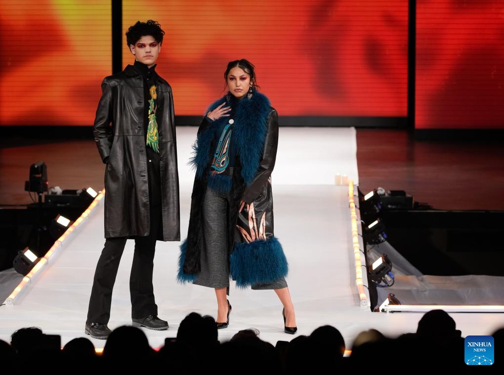 Models present creations during the runway show at Vancouver Indigenous Fashion Week 2024 in Vancouver, British Columbia, Canada, Nov. 20, 2024. (Photo by Liang Sen/Xinhua)