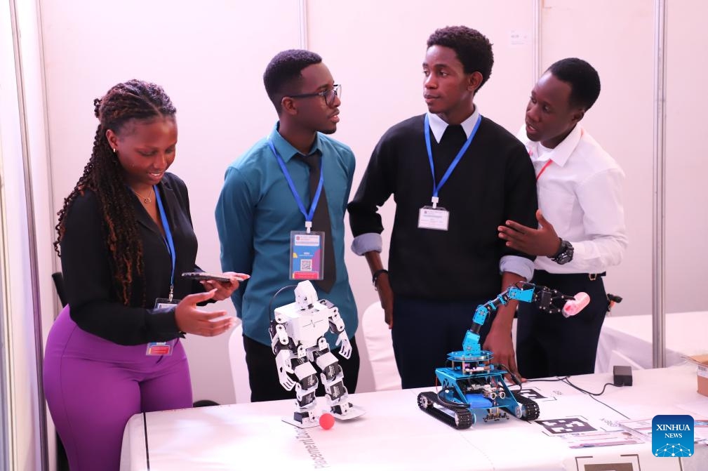 Students showcase their robotic designs during a job fair in Kampala, Uganda, on Nov. 21, 2024. The Ugandan government and Chinese technology firm Huawei on Thursday launched a two-day job fair aimed at promoting youth employment in the information, communication and technology (ICT) sector. (Photo by Ronald Ssekandi/Xinhua) 