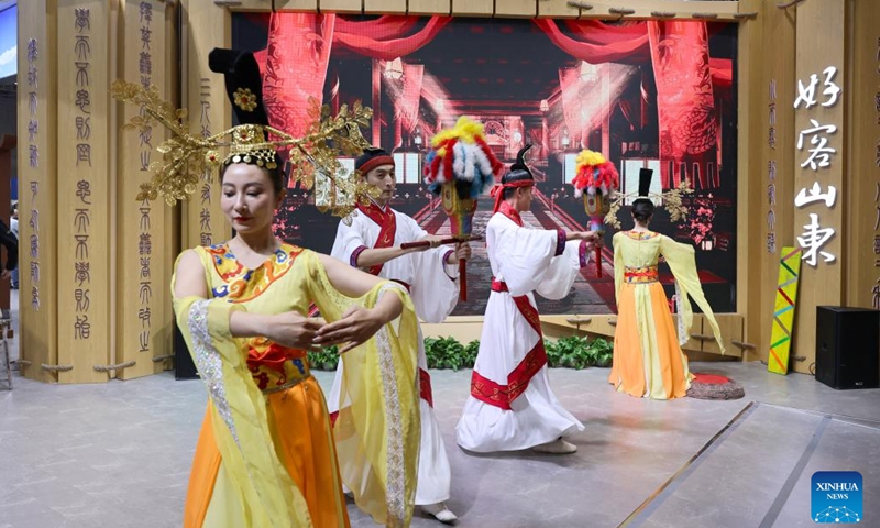 Dancers perform at the booth of east China's Shandong Province during the China International Travel Mart 2024 in east China's Shanghai, Nov. 22, 2024. The China International Travel Mart 2024, organized by the Ministry of Culture and Tourism, kicked off Friday in Shanghai, bringing together exhibitors from over 80 countries and regions. The three-day fair has attracted more than 1,000 international exhibitors and nearly 600 travel agencies, along with over 600 offline buyer-seller meetings, according to the organizers. (Xinhua/Fang Zhe)