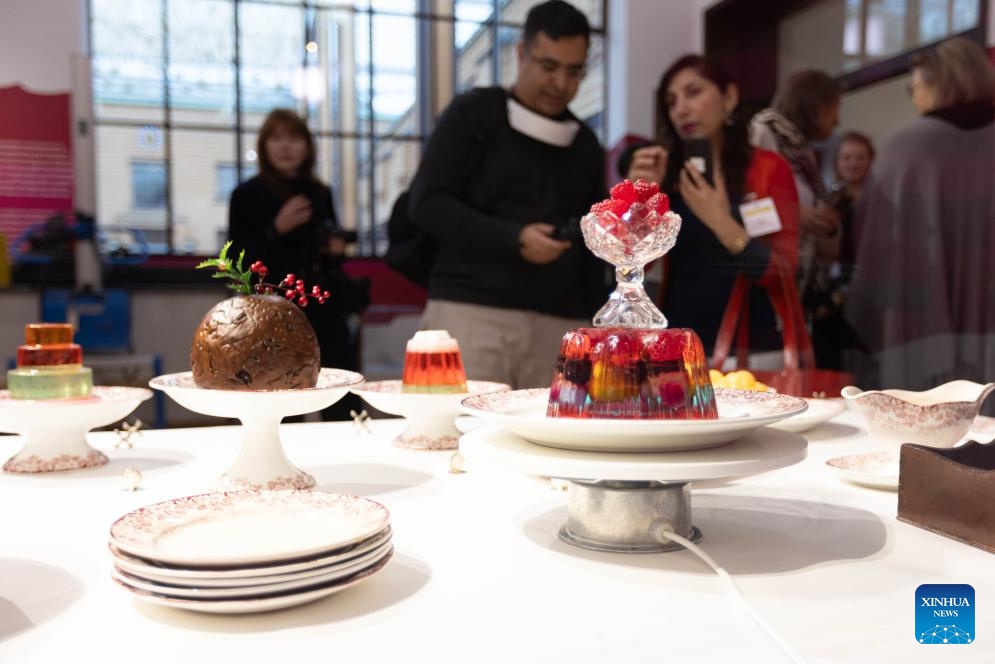 People view exhibits during a press preview of the exhibition Grand Dessert - The History of Dessert at the Kunstmuseum in The Hague, the Netherlands, on Nov. 22, 2024. Showcasing a rich array of desserts through centuries of culinary culture, the exhibition will be open to the general public from Nov. 23, 2024 to April 6, 2025. (Photo by Sylvia Lederer/Xinhua)