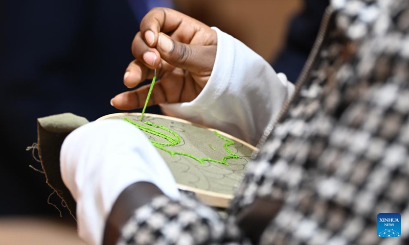 Kalkidan tries traditional Chinese embroidery at the 2024 World Vocational and Technical Education Development Conference in Tianjin, north China, Nov. 22, 2024.(Photo: Xinhua)